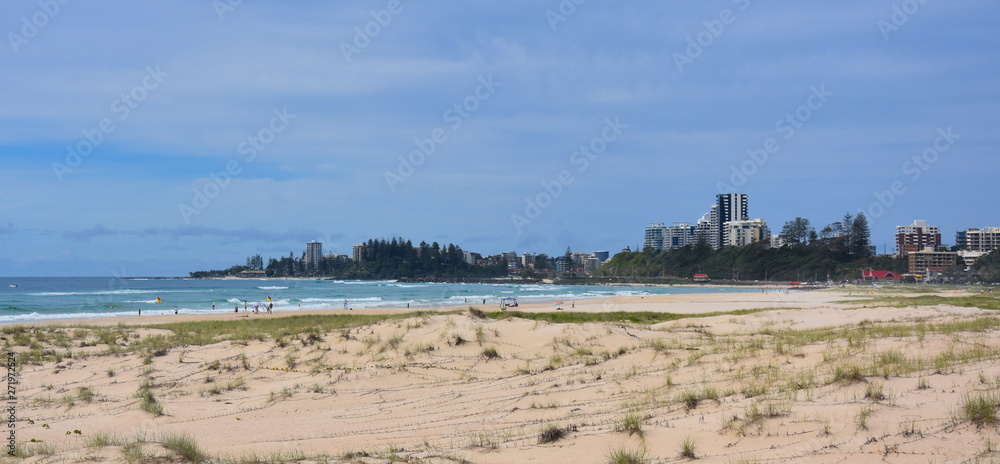 View of Coolangatta from Tugun Esplanade. People relaxing and sunbathing on Kirra Beach. View of Coolangatta from Tugun Esplanade. People relaxing and sunbathing on Kirra Beach.