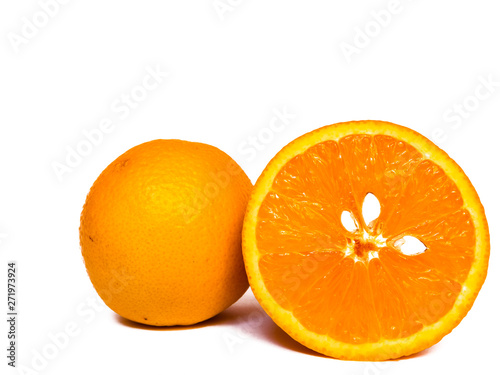 Close-up view of isolated orange halves with white seeds on white background with copy space.