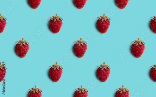 Fresh strawberries pattern isolated on blue background. Summer Fruit.