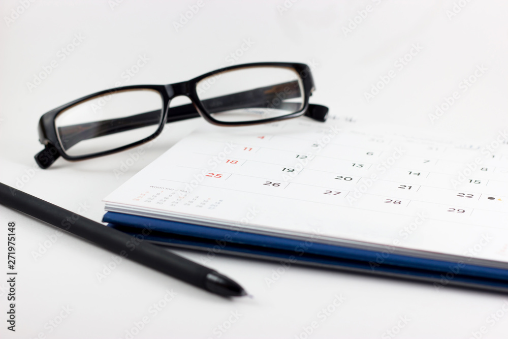 Calendar, eyeglasses and pen on white background. Calendar, eyeglasses and pen on white background.