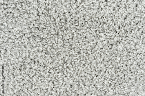 White natural fleece carpet texture background. Wool fabric texture fragment shaggy mat