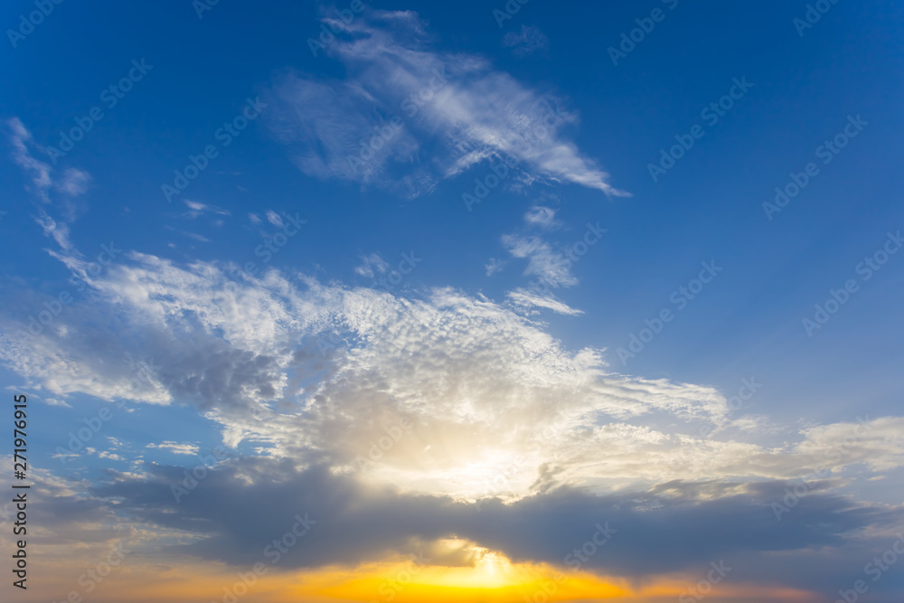 dramatic sunset on the cloudy sky background