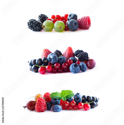 Berries isolated on white background. Ripe blueberries, blackberries, blackcurrants, strawberries, raspberries, gooseberries and red currants. Various fresh summer berry.
