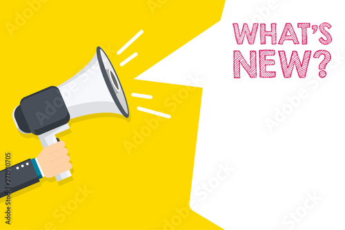 Hand holding megaphone with What's New? text. Hand holding megaphone with open space for your text.