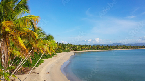 Amazing view of a wild beach with palm trees. Beautiful mountains on the horizon and blue sky. Thailand Phuket wild beach. The best beaches of world. Palms beach and blue sea and sky. Summer vacation © murkalor7