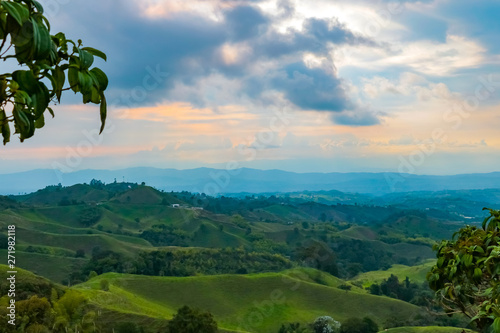 view over a beautiful south american mountain landscape with blue sky in colombia,  coffee growing axis