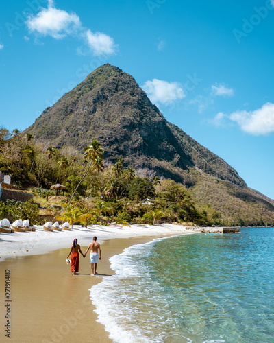 couple on vacation in St Lucia, men and woman walking on the beach Saint Lucia