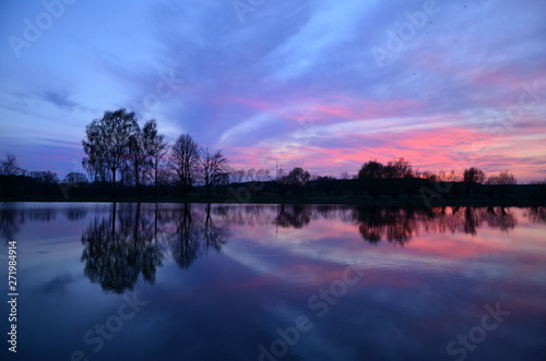 sunset on the lake reflection in water pacification  slackness  camping relaxation relaxationess