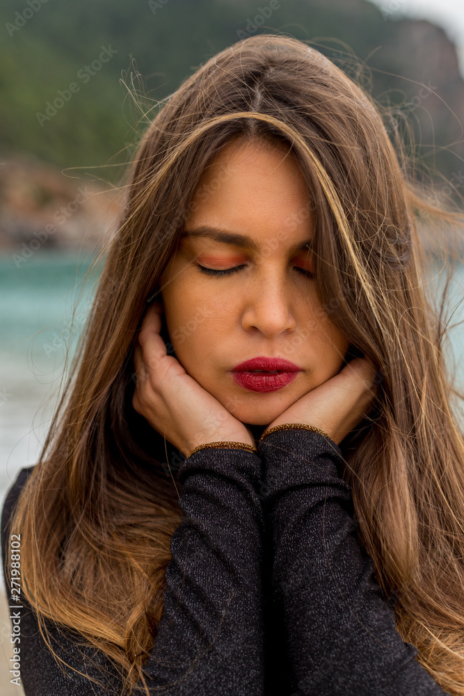 Head and shoulders portrait of beautiful female with eyes closed Head and shoulders portrait of beautiful female with eyes closed