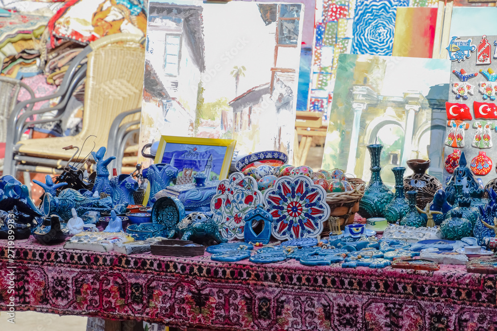 Trading table with souvenirs and paintings for tourists.