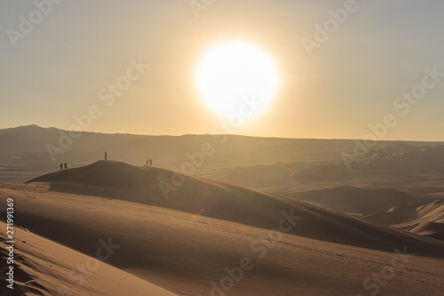 sunset at huacachina desert oasis in peru