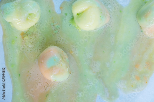 Photography Melting rainbow sherbet ice cream from summer heat.
