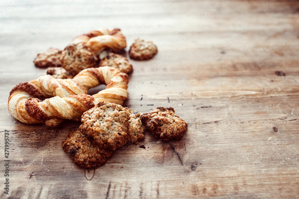 Cookies on a rustic wooden table. Homemade cookies with nuts and dried fruit. Top view flat lay background. Space for text. cookies on wooden table background Cookies on a rustic wooden table. Homemade cookies with nuts and dried fruit. Top view flat lay background. Space for text. cookies on wooden table background