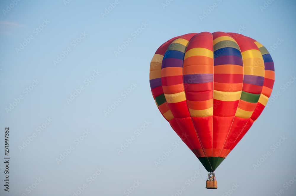 Big balloon. Balloon. Colorful bowl with basket. In the sky soars in the summer Big balloon. Balloon. Colorful bowl with basket. In the sky soars in the summer