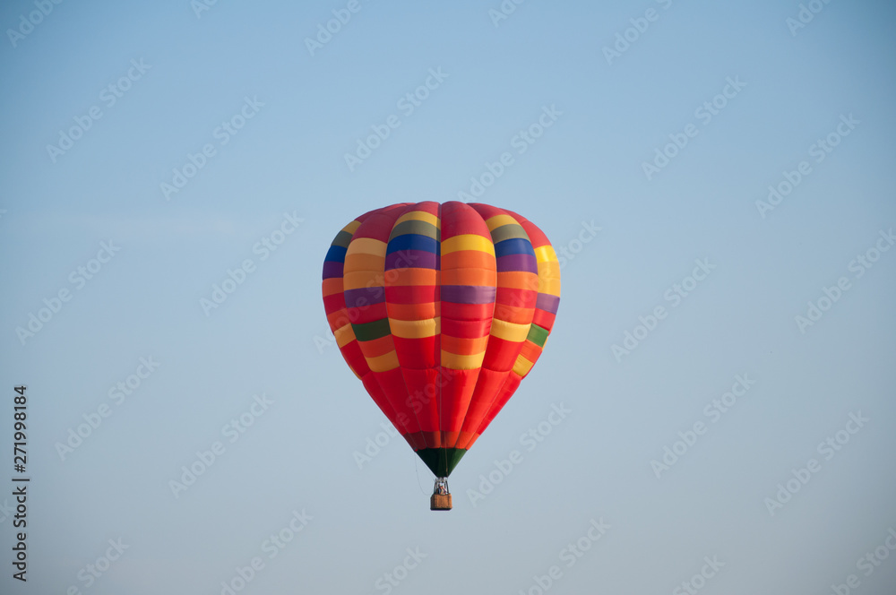 Big balloon. Balloon. Colorful bowl with basket. In the sky soars in the summer	