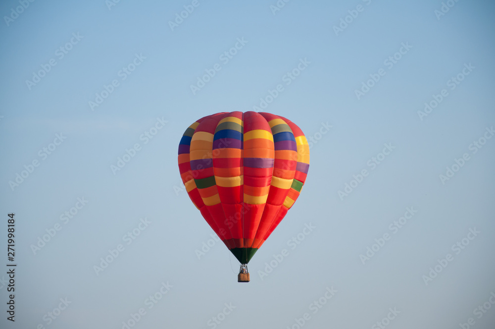 Big balloon. Balloon. Colorful bowl with basket. In the sky soars in the summer Big balloon. Balloon. Colorful bowl with basket. In the sky soars in the summer