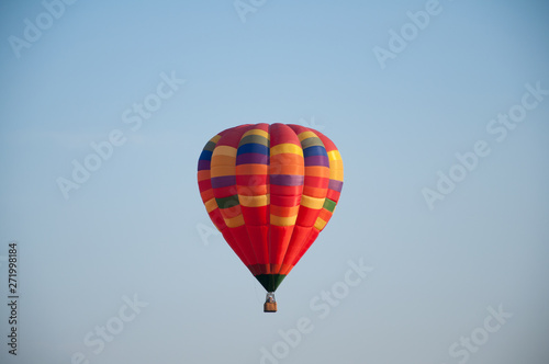 Big balloon. Balloon. Colorful bowl with basket. In the sky soars in the summer 