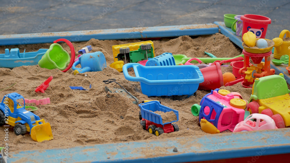 Children's Sandbox. Set Of Colored Plastic Toys On The Sand, Children's Sandbox. Set Of Colored Plastic Toys On The Sand,