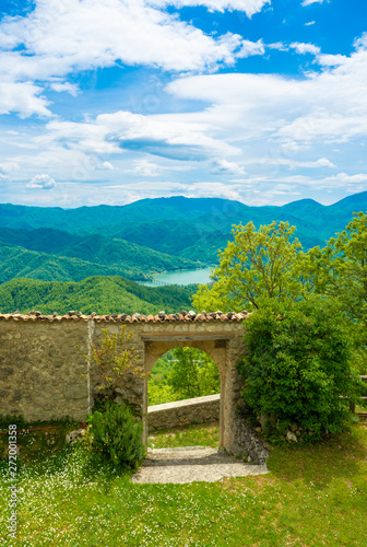 Cicolano (Italy) - The green mountain area of Salto Lake, Lazio region province of Rieti, with the ruins of medieval castle named Poggio Poponesco photo