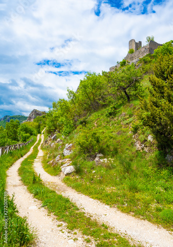 Cicolano (Italy) - The green mountain area of Salto Lake, Lazio region province of Rieti, with the ruins of medieval castle named Poggio Poponesco photo