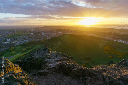 Sunset over Edinburgh viewed from the top of Arthur's Seat, Scotland.