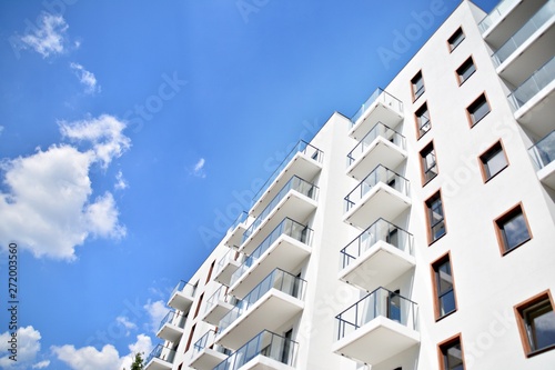 Modern apartment buildings on a sunny day with a blue sky. Facade of a modern apartment building