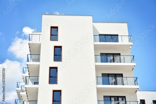 Modern apartment buildings on a sunny day with a blue sky. Facade of a modern apartment building