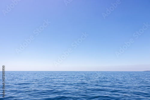 Fototapeta Naklejka Na Ścianę i Meble -  Seascape with sea horizon and almost clear deep blue sky