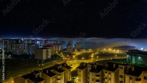 long exposure city when the fog comes under star light