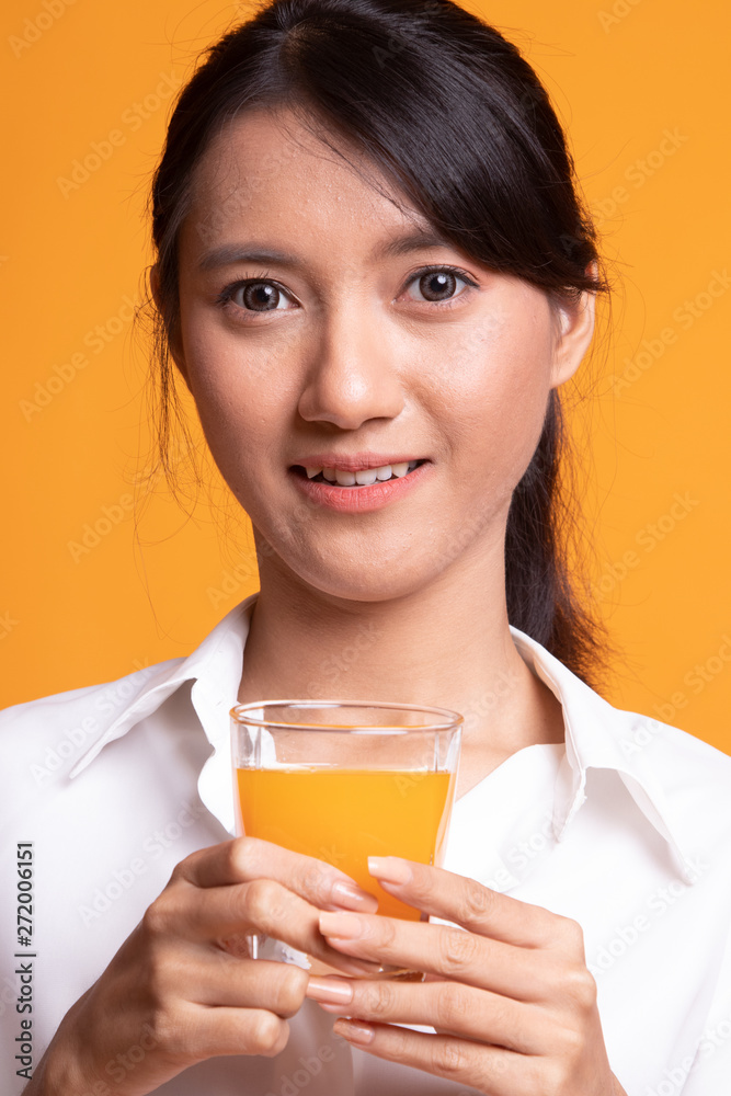 Young Asian woman drink orange juice. Young Asian woman drink orange juice.