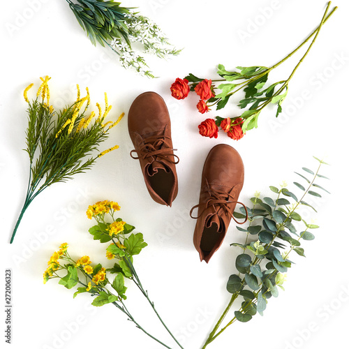 Fashionable women's shoes on white background with shades. Black boots, brown boots. Walking shoes. Flat lay, top view trendy fashion feminine background. Beauty blog concept.