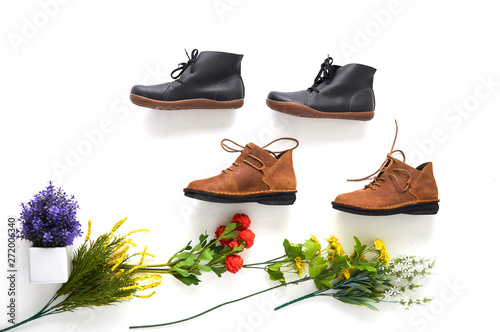 Fashionable women's shoes on white background with shades. Black boots, brown boots. Walking shoes. Flat lay, top view trendy fashion feminine background. Beauty blog concept.