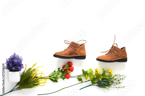 Fashionable women's shoes on white background with shades. Black boots, brown boots. Walking shoes. Flat lay, top view trendy fashion feminine background. Beauty blog concept.