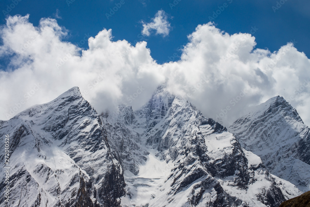 mountain peaks in the clouds