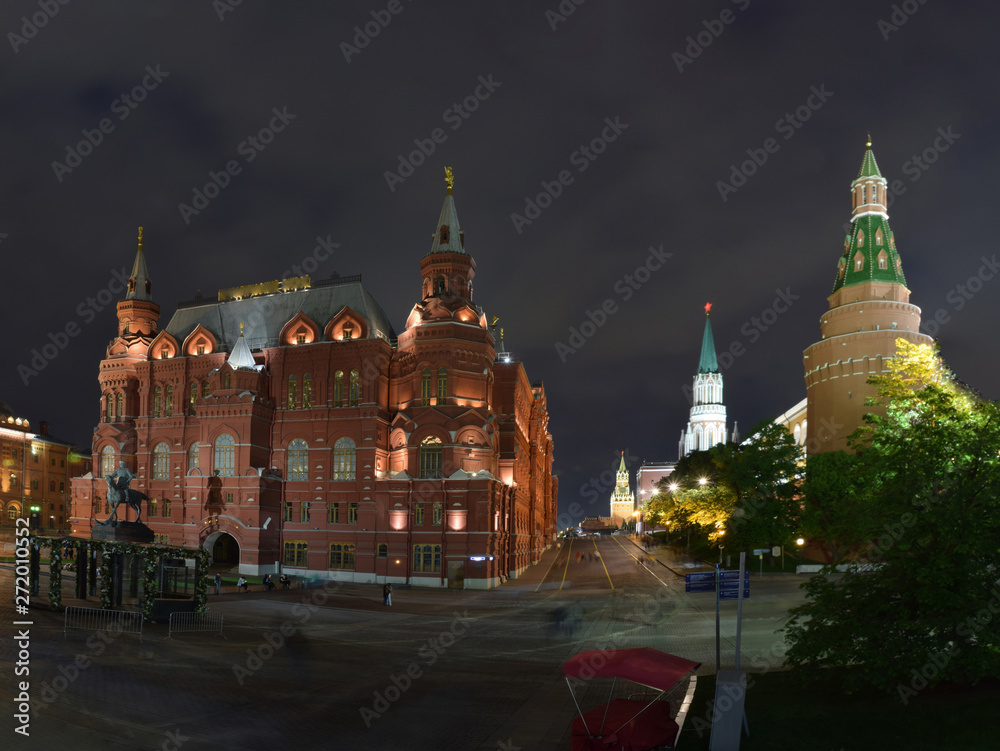 Fototapeta premium Night view of the historical museum and the Kremlin Arsenal Tower from Manezh Square. Russia, Moscow, May 2019
