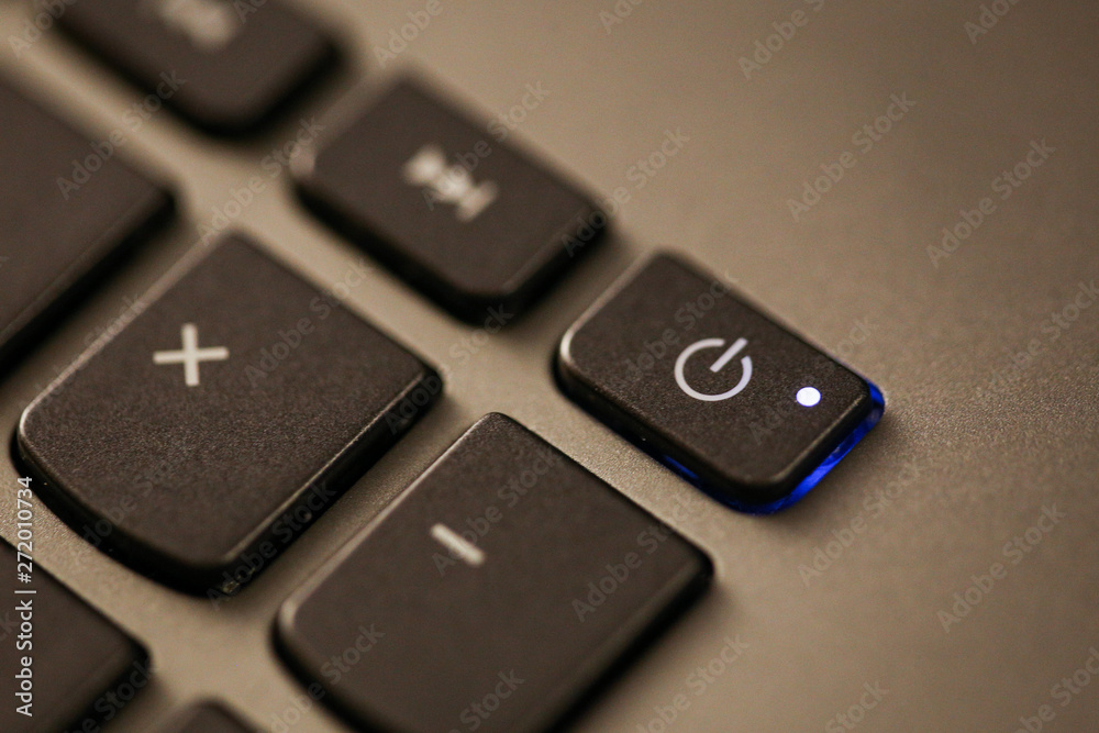 Details with the Power ON/OFF button on a laptop/computer keyboard. Details with the Power ON/OFF button on a laptop/computer keyboard.