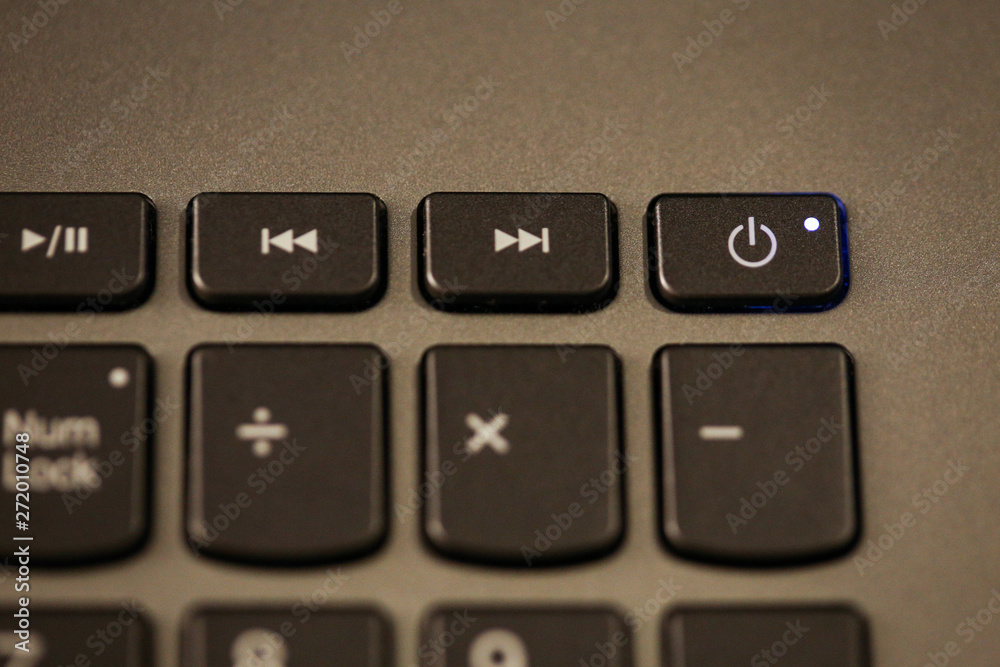 Details with the Power ON/OFF button on a laptop/computer keyboard.