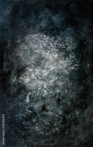 Old dark concrete background with white splatter