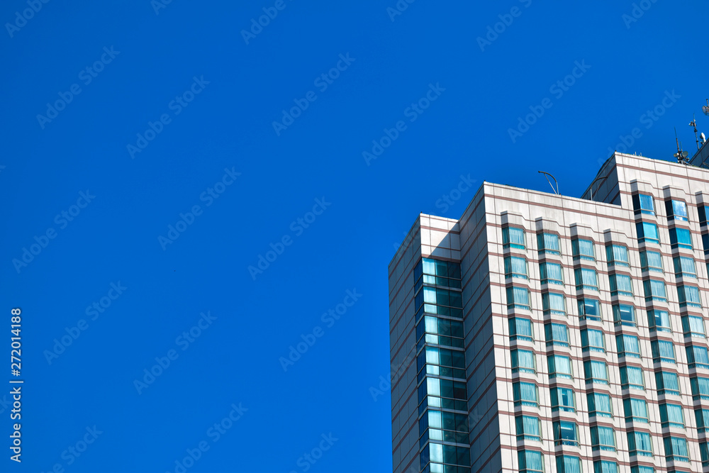 Fototapeta premium modern glass and steel office buildings low angle view at Jakarta, Indonesia