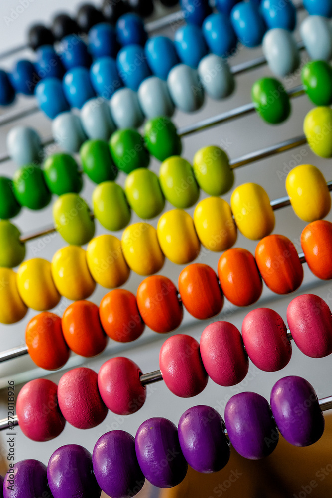 Abacus with colorful beads. Blurry background Abacus with colorful beads. Blurry background
