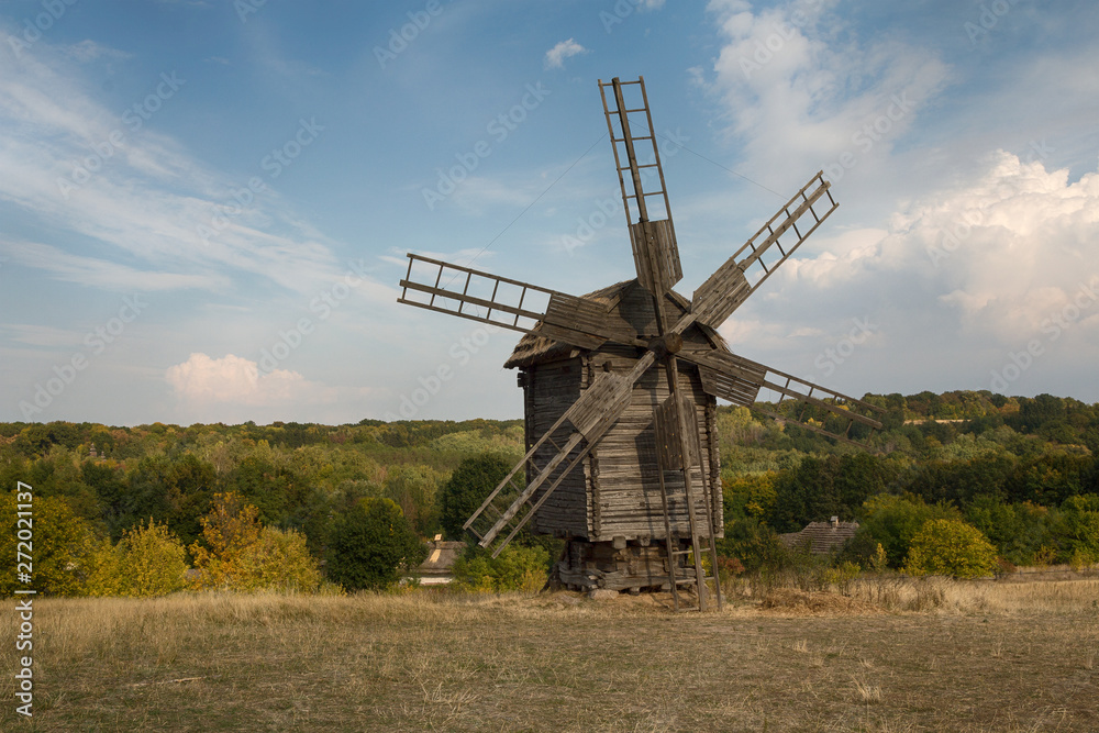 Old antique wooden mill in Pirogovo. Kiev, Ukraine Old antique wooden mill in Pirogovo. Kiev, Ukraine