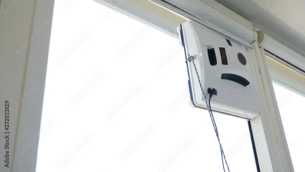 house keeping service . Robot glass washer square in shape moving on window. Small robot glass washer cleaning window in apartment. Contactless glass washer machine. 4k house keeping service . Robot glass washer square in shape moving on window. Small robot glass washer cleaning window in apartment. Contactless glass washer machine. 4k