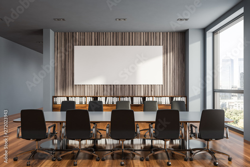 Gray and wooden meeting room with poster photo