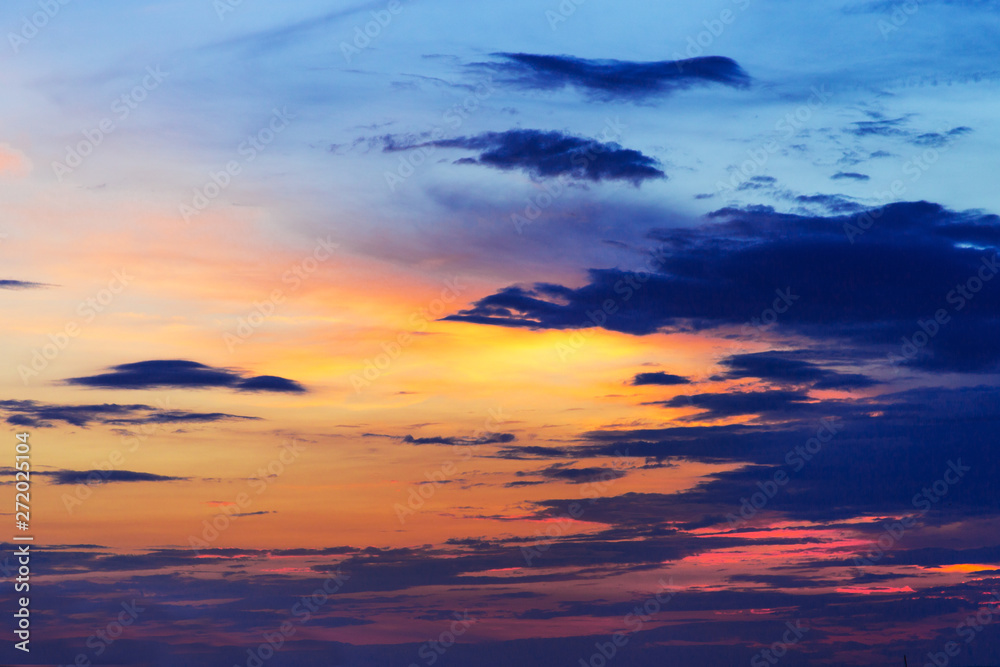 colorful dramatic sky with clouds at sunset.
