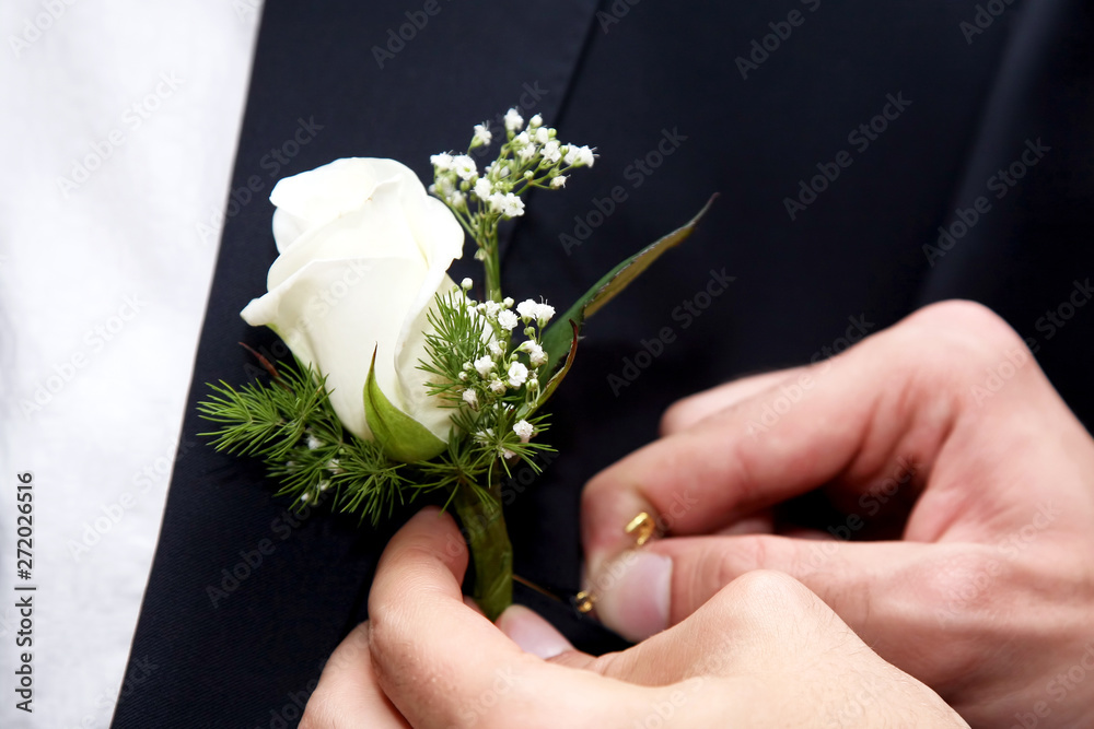 help the groom to pin a wedding flower to suit help the groom to pin a wedding flower to suit