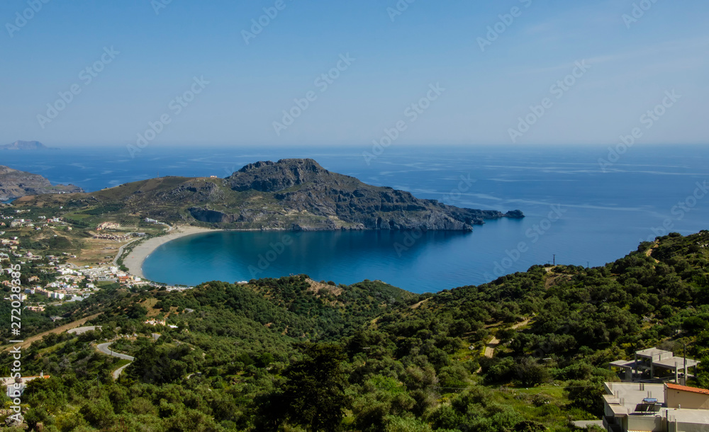 Obraz premium Harbour with marine vessels. View from the top on Bay with beach and architecture - vacation destination resort, with clear turquoise ocean waters, Plakias, Crete, Greece