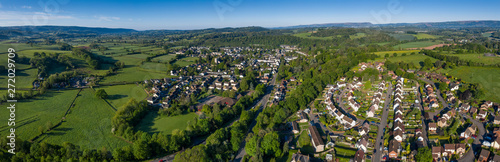 Residential housing estate in Usk, south Wales, UK, with the town of Usk in the background