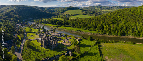 Aerial panoramic view of the ruins of Tintern Abbey, a Cistercian monastry located by the river Wye in South Wales, UK photo