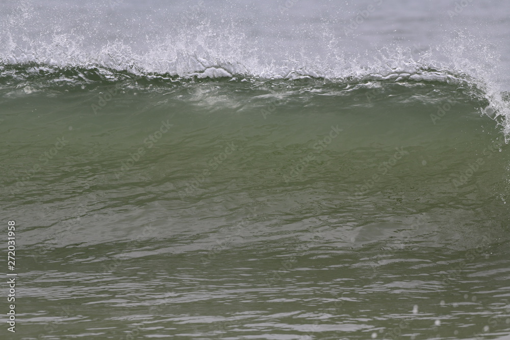Ocean wave crashing on the beach Ocean wave crashing on the beach
