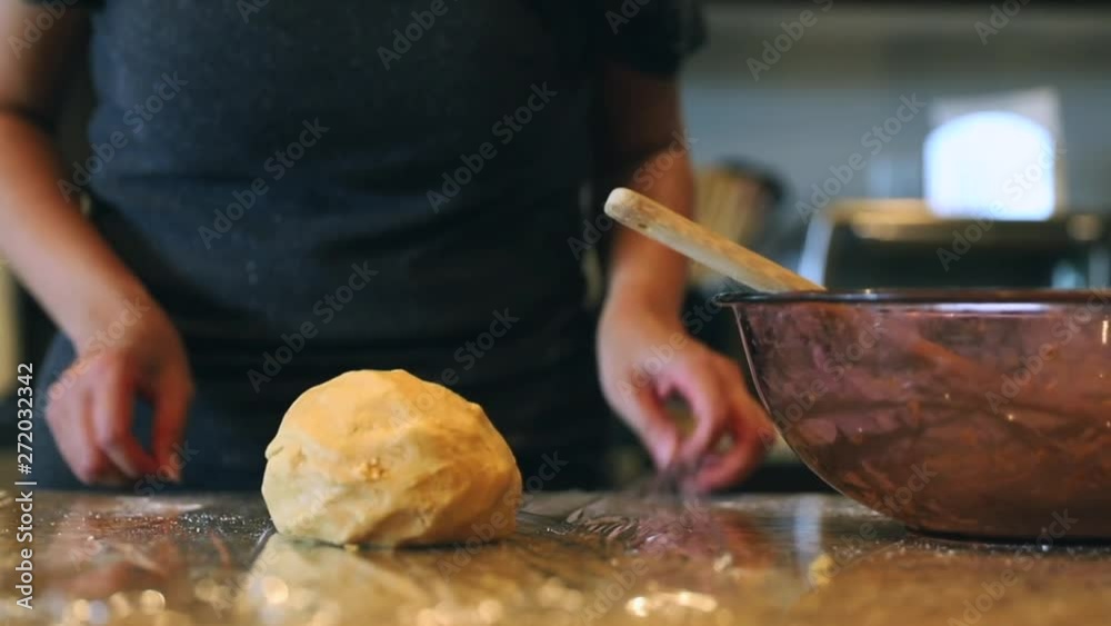 Female, kneading cookie dough, than wrapping dough, Los Angeles Female, kneading cookie dough, than wrapping dough, Los Angeles